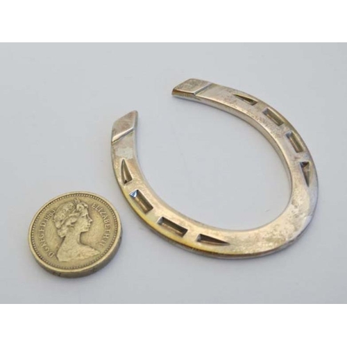 217 - A silver miniature model of a horseshoe. Hallmarked Sheffield 2004 maker Francis Howard (30g)  2 1/2... 