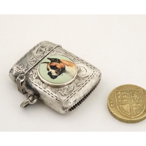 221 - A silver vesta case with later applied 21stC ceramic cabochon with dog decoration. The whole 1 3/4''... 