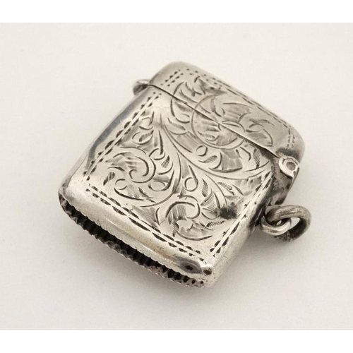 221 - A silver vesta case with later applied 21stC ceramic cabochon with dog decoration. The whole 1 3/4''... 