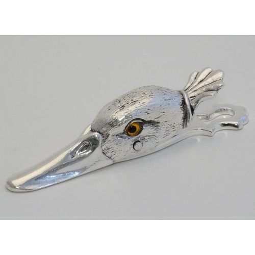 225 - A silver plate desk top letter clip in the form of a ducks head. 21stC.  5'' long