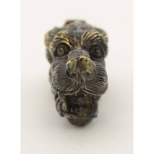 229 - A late 20thC / early 21stC novelty vesta formed as the head of a dog. 2 3/4'' long