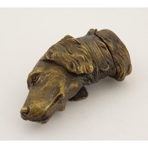 231 - A gilt base metal novelty vesta formed as the head of a gundog. 21stC . 2'' long