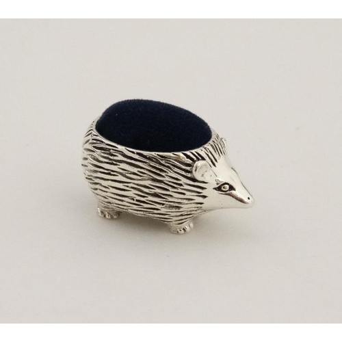 235 - A small silver pin cushion formed as a hedgehog. Marked '925 Sterling'.  21stC 1 1/4'' long