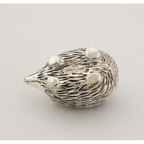 235 - A small silver pin cushion formed as a hedgehog. Marked '925 Sterling'.  21stC 1 1/4'' long