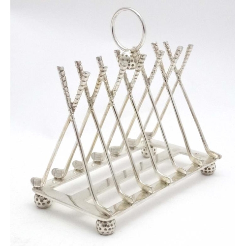 238 - A novelty 6-slice silver plated toast rack, the bars formed as crossed golf clubs. 21stC  Approx 6 1... 