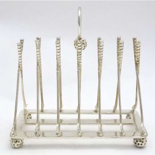 238 - A novelty 6-slice silver plated toast rack, the bars formed as crossed golf clubs. 21stC  Approx 6 1... 