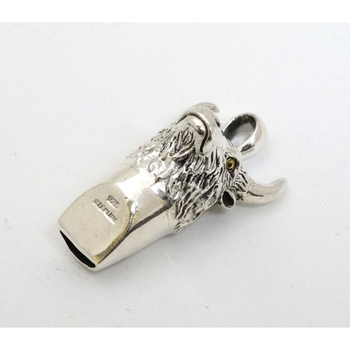 245 - A novelty silver whistle with bulls head decoration. 21stC  1 1/2'' high