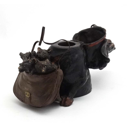 247 - A late 20thC decorative cold painted bronze novelty inkwell formed as a dog holding a bag of puppies... 