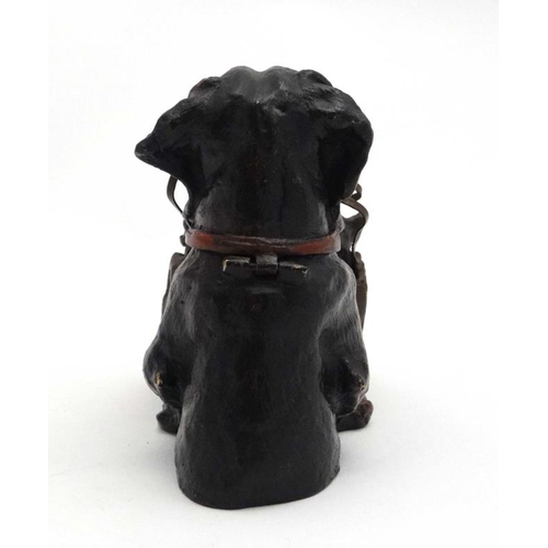 247 - A late 20thC decorative cold painted bronze novelty inkwell formed as a dog holding a bag of puppies... 