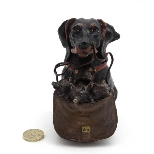 247 - A late 20thC decorative cold painted bronze novelty inkwell formed as a dog holding a bag of puppies... 