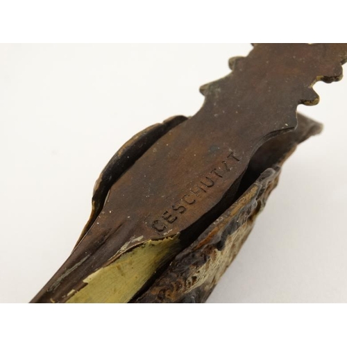 249 - A novelty desk top letter / pepper clip formed as the head of a game bird, with cold painted decorat... 