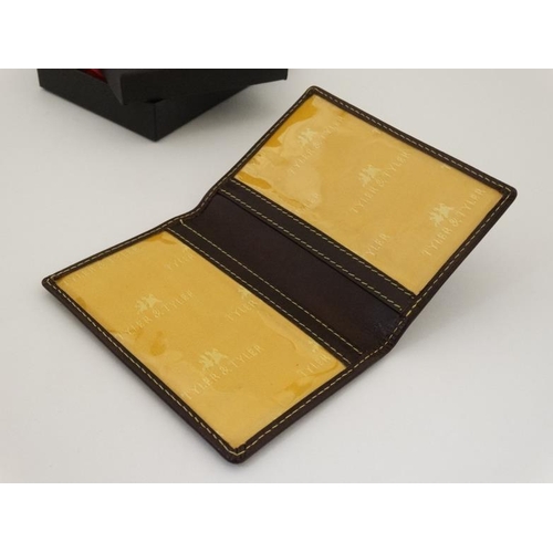 257 - Rugby interest: A Tyler & Tyler leather card holder with image to one corner of a rugby player in si... 