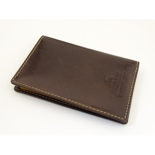 257 - Rugby interest: A Tyler & Tyler leather card holder with image to one corner of a rugby player in si... 