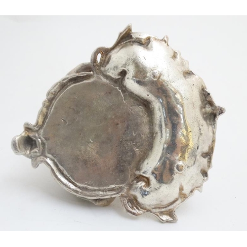 259 - A silver plate inkwell in the form of a dog's head with a C shaped Rococo Revival pen dish with glas... 