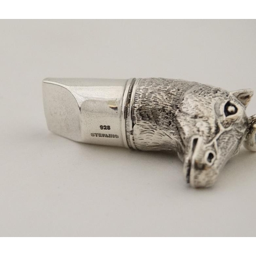 266 - A silver whistle with horsehead decoration. marked '925 Sterling '. 21stC.  approx 1 3/4'' long