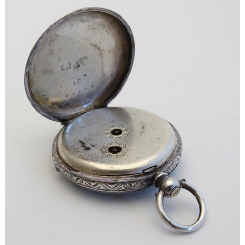 269 - A ladies hallmarked silver pocket watch with later applied ceramic cabochon decorated with  head of ... 