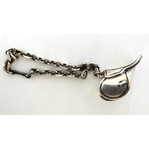 271 - A white metal chain and pendant fob / charm formed as a miniature saddle. Engraved Pour Les 2000 d'Y... 