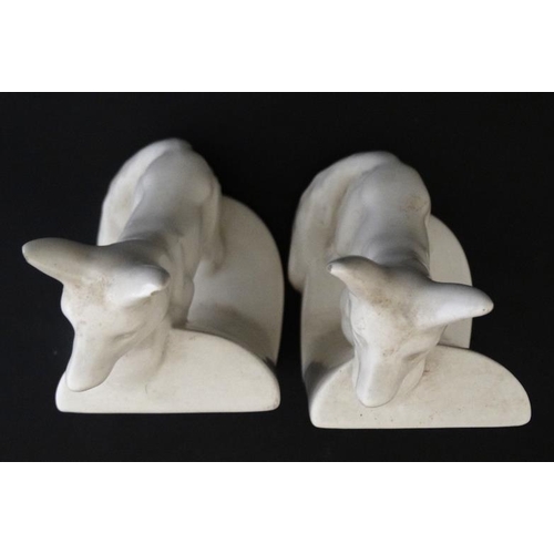 275 - Ceramic Bookends : a pair of continental white glaze bookends formed as foxes peering over a wall , ... 