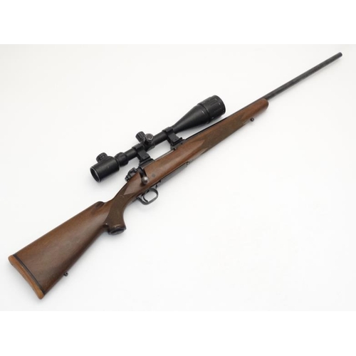 516 - Centrefire Rifle : A Winchester ' Model 70 SA ' .243WIN bolt action Rifle , fitted with a Option Zer... 