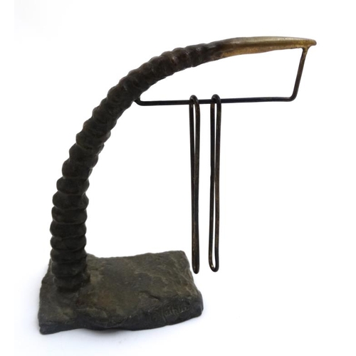 71 - A cast bronze desk calendar  in the form of an African Deer antler with hanging sections for numbers... 