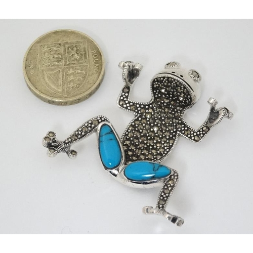 1000 - A silver pendant formed as a frog with marcasite and turquoise decoration. Approx 1 3/4'' high