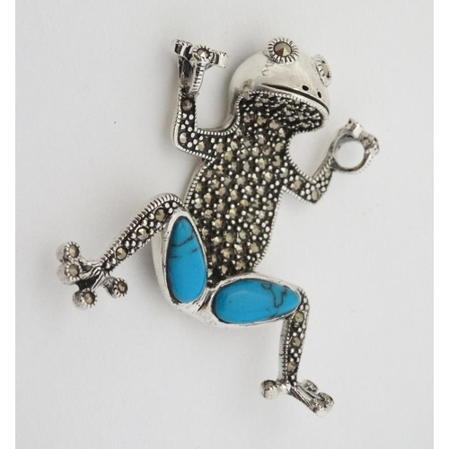 1000 - A silver pendant formed as a frog with marcasite and turquoise decoration. Approx 1 3/4'' high