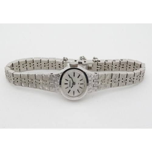 1012 - Stainless Stell Ladies Watch : a Seiko Mechanical Wristwatch with brushed patterned strap , oval sig... 