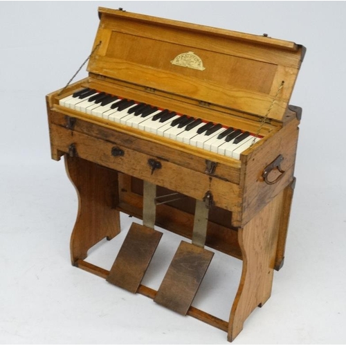 1023 - Musical Instruments : An unusual early 20thC Portable Organ by R F Stevens Ltd , Kentish Town , Lond... 