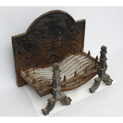 1038 - Fire back etc. : a cast iron 20 thC fire back , andirons and basket measuring 14'' deep x 27 3/4 '' ... 