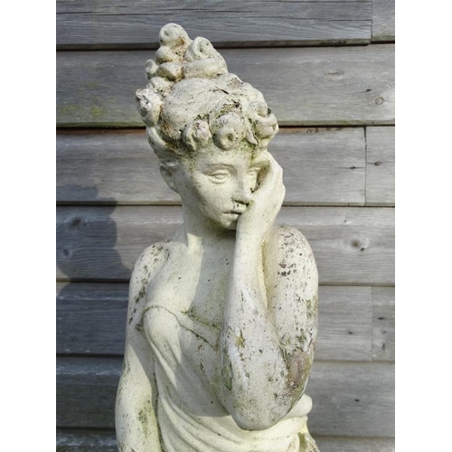 1040 - A white painted reconstituted stone statue depicting a female figure. Approx 26'' high