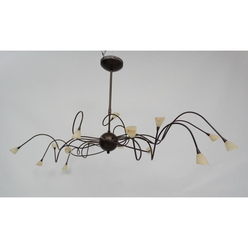 121 - Mid Century : a patinated bronze finish ceiling light , a Spider Ceiling Lamp ,  having 15 arms, 54'... 