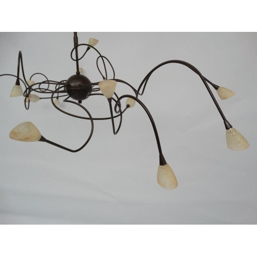 121 - Mid Century : a patinated bronze finish ceiling light , a Spider Ceiling Lamp ,  having 15 arms, 54'... 