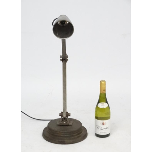 146 - Vintage Industrial  :  a Machinist's lamp standing on a turned circula base, with steel shade.