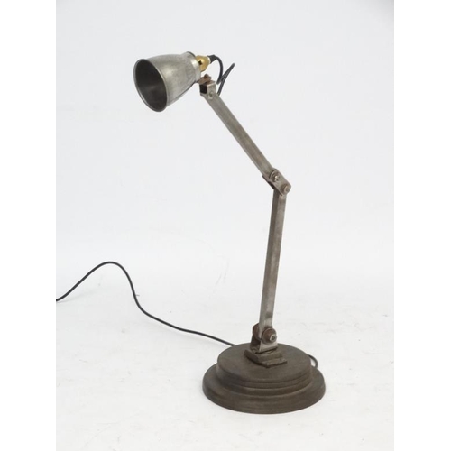 146 - Vintage Industrial  :  a Machinist's lamp standing on a turned circula base, with steel shade.