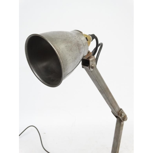 146 - Vintage Industrial  :  a Machinist's lamp standing on a turned circula base, with steel shade.