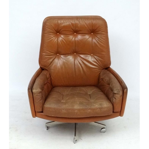 149 - Vintage Retro : - A Danish Farstrup Brown Leather Tilt and Swivel armchair with button back upholste... 