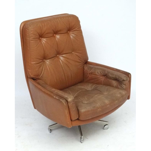 149 - Vintage Retro : - A Danish Farstrup Brown Leather Tilt and Swivel armchair with button back upholste... 