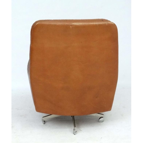 149 - Vintage Retro : - A Danish Farstrup Brown Leather Tilt and Swivel armchair with button back upholste... 