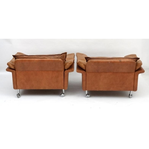 154 - Vintage Retro :a pair Pair of Swedish ' Dux ' tan leather (button back arms and seat) armchairs stan... 