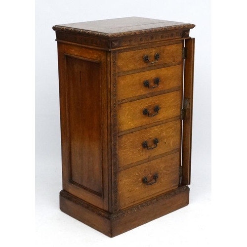 156 - Edwards & Roberts : A late 19thC oak Wellington chest of 5 graduated drawers ( stamped to top) 42'' ... 