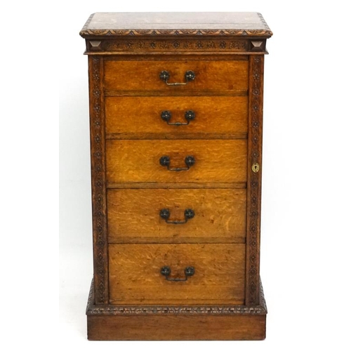 156 - Edwards & Roberts : A late 19thC oak Wellington chest of 5 graduated drawers ( stamped to top) 42'' ... 