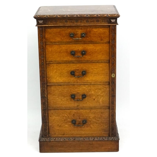 156 - Edwards & Roberts : A late 19thC oak Wellington chest of 5 graduated drawers ( stamped to top) 42'' ... 