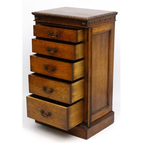 156 - Edwards & Roberts : A late 19thC oak Wellington chest of 5 graduated drawers ( stamped to top) 42'' ... 