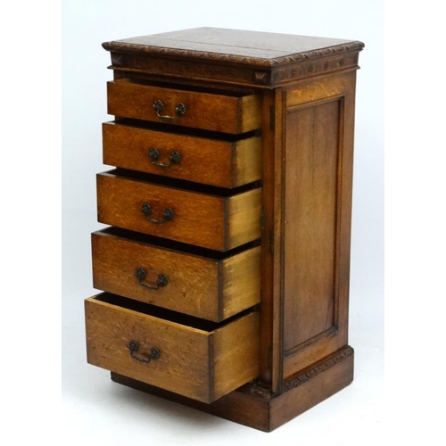 156 - Edwards & Roberts : A late 19thC oak Wellington chest of 5 graduated drawers ( stamped to top) 42'' ... 