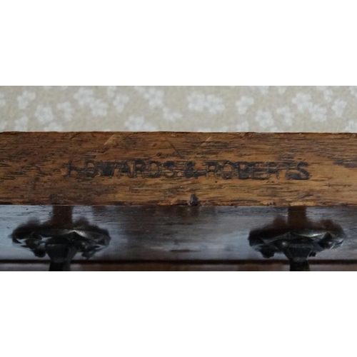 156 - Edwards & Roberts : A late 19thC oak Wellington chest of 5 graduated drawers ( stamped to top) 42'' ... 