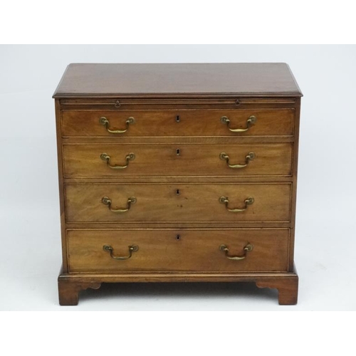 159 - An 18thC Georgian mahogany bachelors chest with brushing slide and four long graduated drawers. 33 1... 