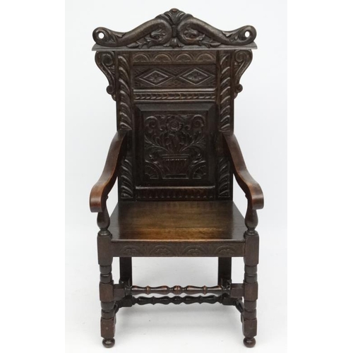 160 - A 19thC carved oak Wainscot chair 49'' high overall.