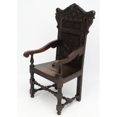 160 - A 19thC carved oak Wainscot chair 49'' high overall.