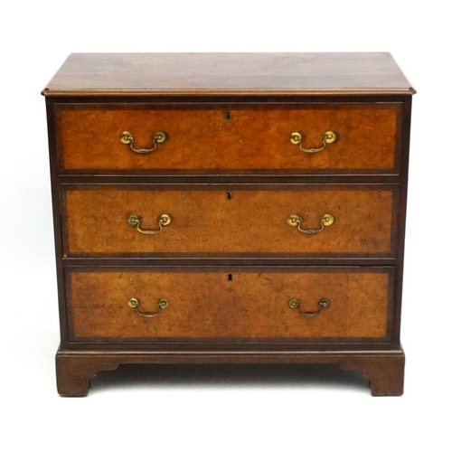 161 - Holland & Sons : An 19thC mahogany and cross banded and burr elm three drawer chest of drawers. Stam... 