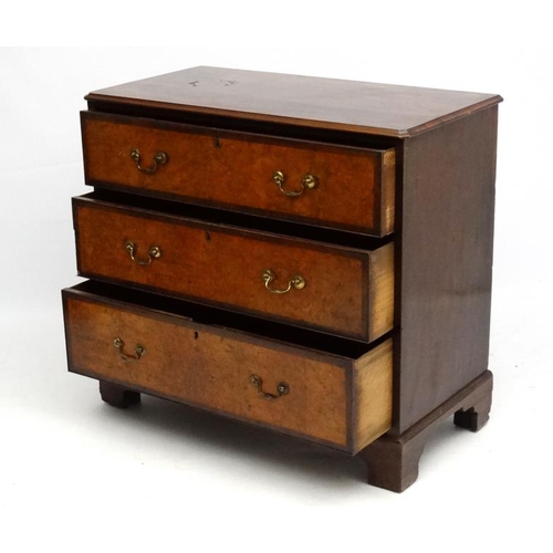 161 - Holland & Sons : An 19thC mahogany and cross banded and burr elm three drawer chest of drawers. Stam... 